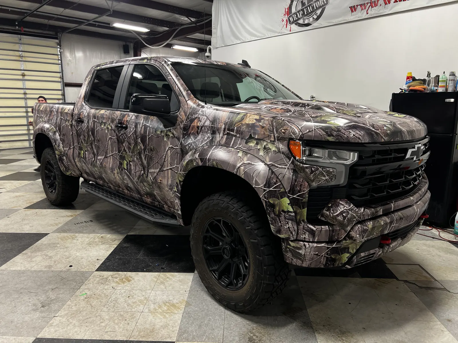 Hunting camo, front angle — Chevy Silverado